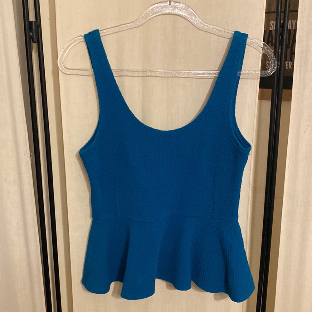 Anthropologie Peplum Top with lots of stretch, Good Used Condition.